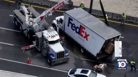 Overturned FedEx truck leads to delays on Turnpike in Miami.